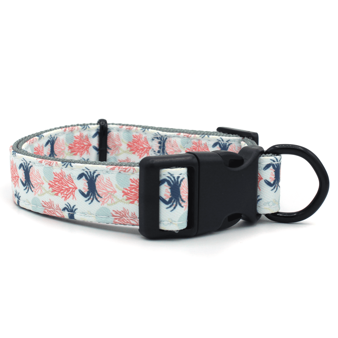 dog collar with blue crab, seashell, and coral pattern, with black hardware