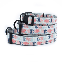 3 collars stacked one on top of the other, all with a beach themed pattern of crabs, seashells, and corals