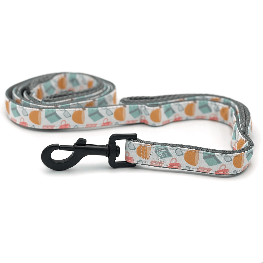 a dog leash with a pattern featuring books and coffee cups