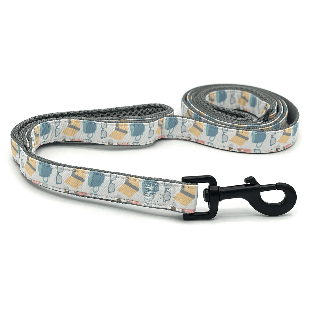 a dog leash with yellow books and blue coffee mugs