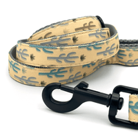 dog leash with green and blue cactuses, black hardware, and grey padded handles