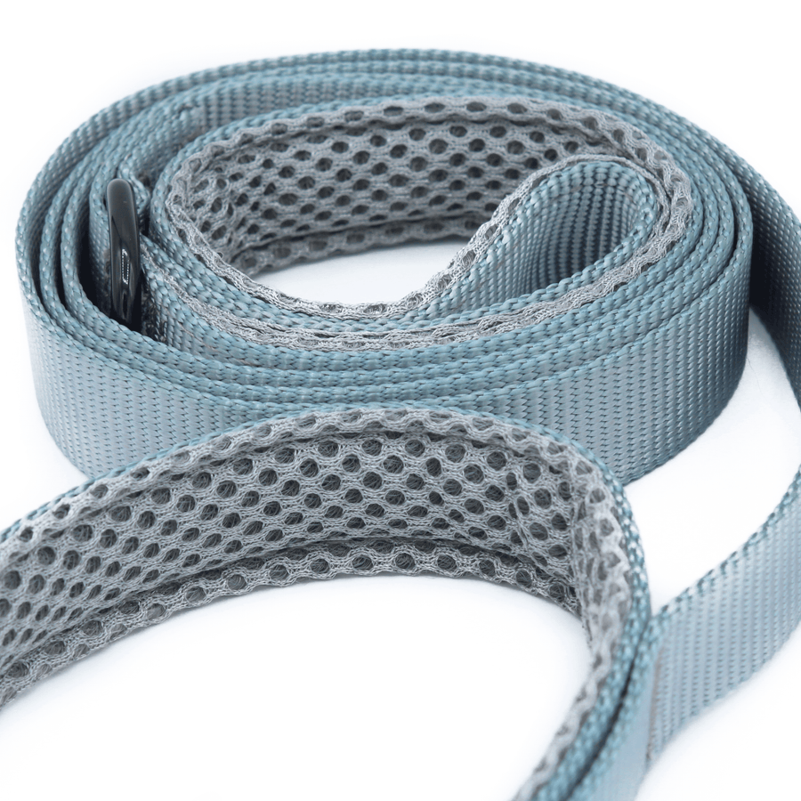 a closeup of a pewter grey leash and grey mesh padded handles