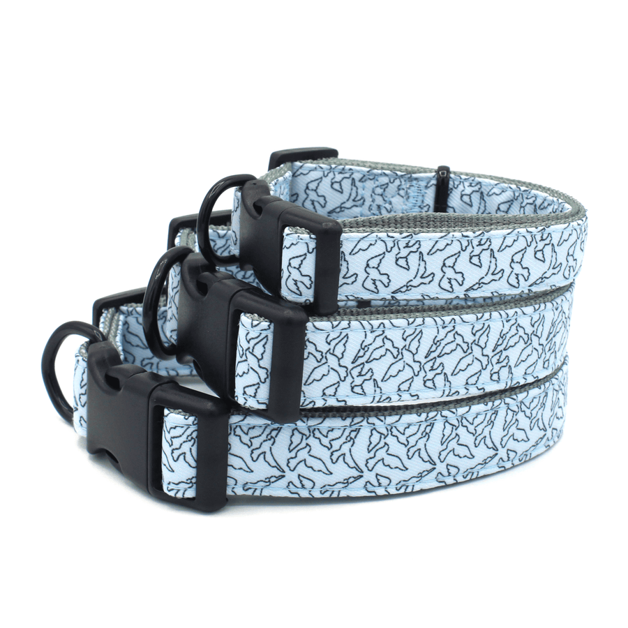3 collars stacked on top of each other all are blue with black birds outline