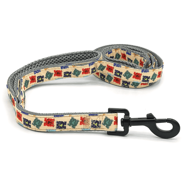 a multi-colored frog patterned dog leash with black clasp